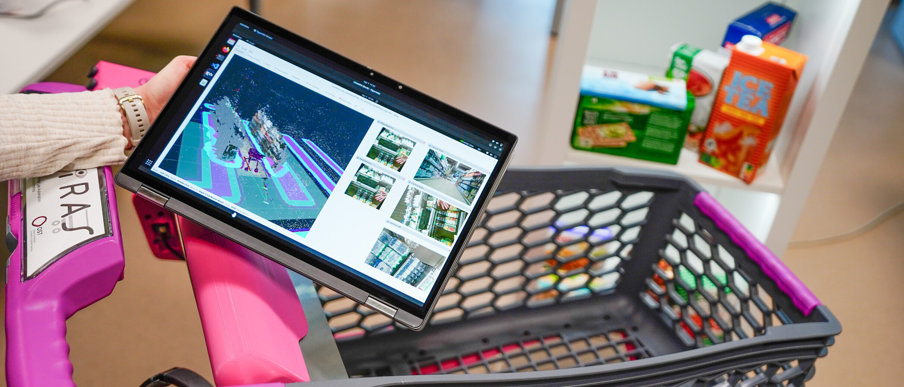 Auf einem Tablet wird gezeigt, wie der intelligente KI-Einkaufswagen seine Umgebung scannt und wahrnimmt.