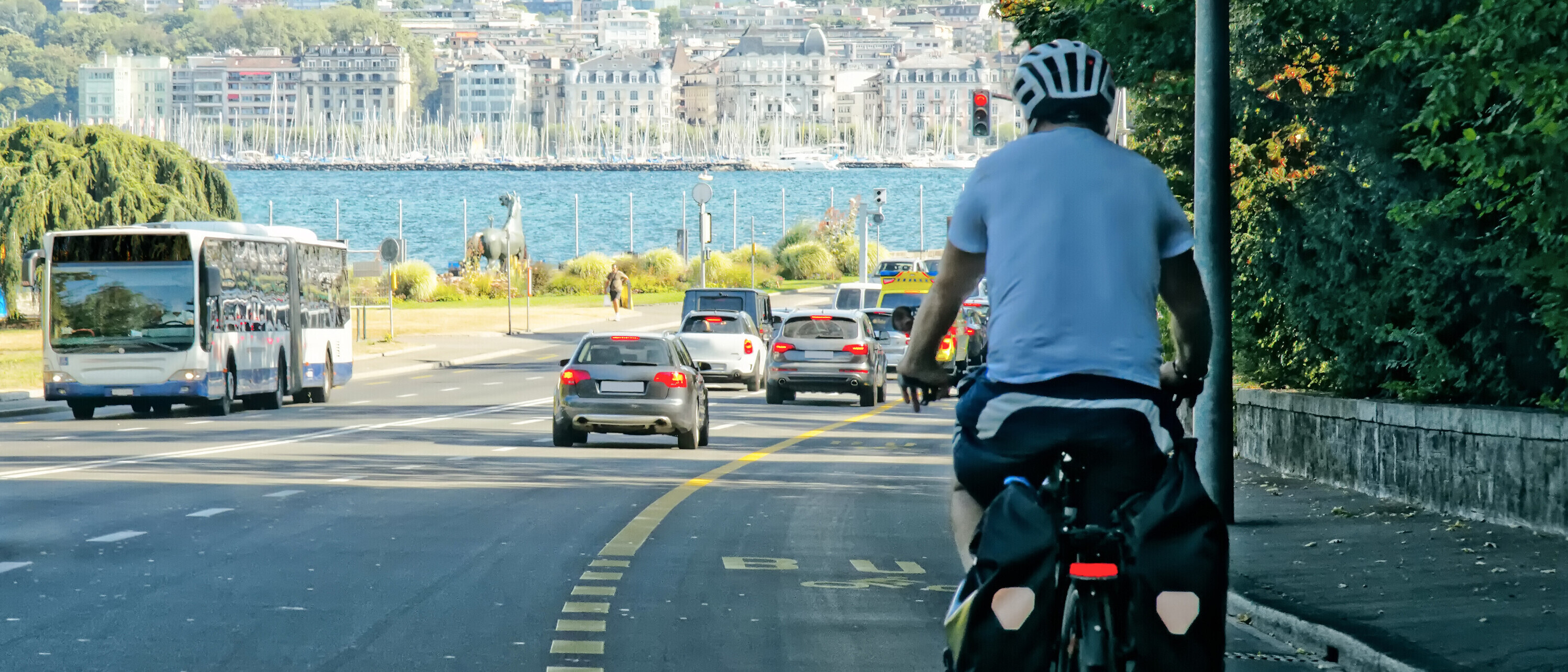 Man on bicycle on the road in Geneva, Switzerland. Man on bicycle on the road in Geneva, Switzerland.