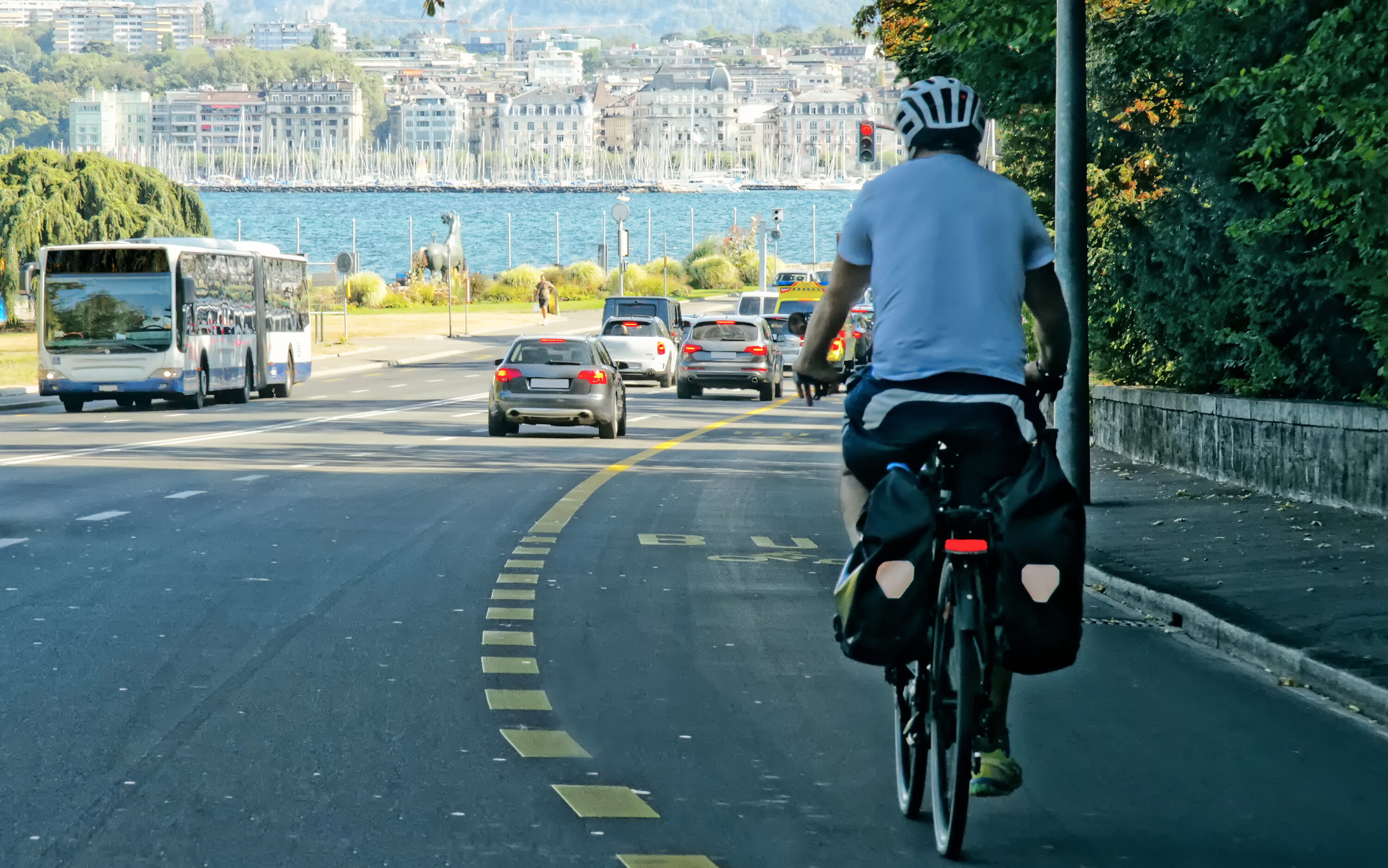 Man on bicycle on the road in Geneva, Switzerland. Man on bicycle on the road in Geneva, Switzerland.