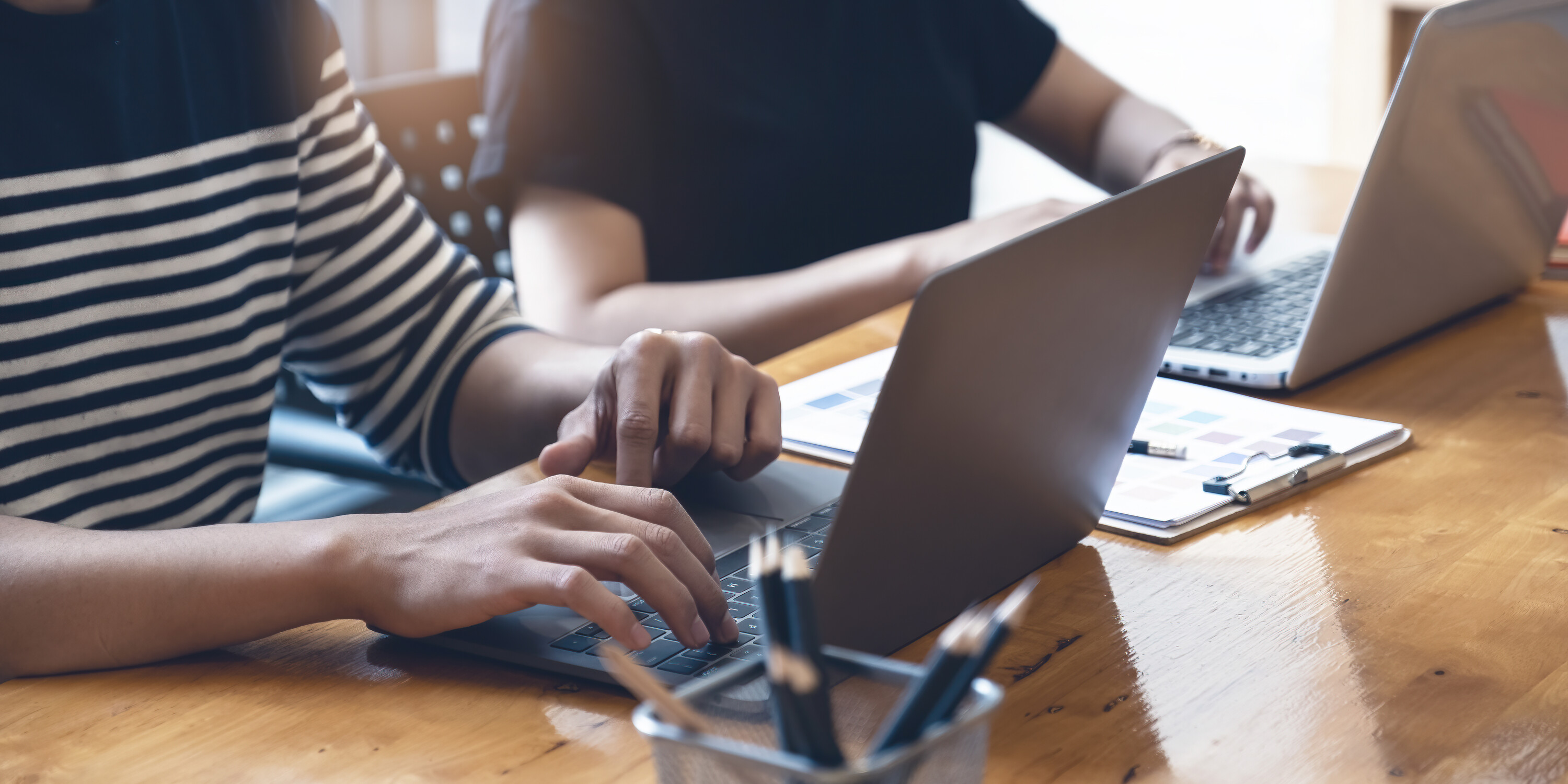 Asian student focus learning online course and watching video tutorial via laptop computer at living room in home,. online class room concept.
